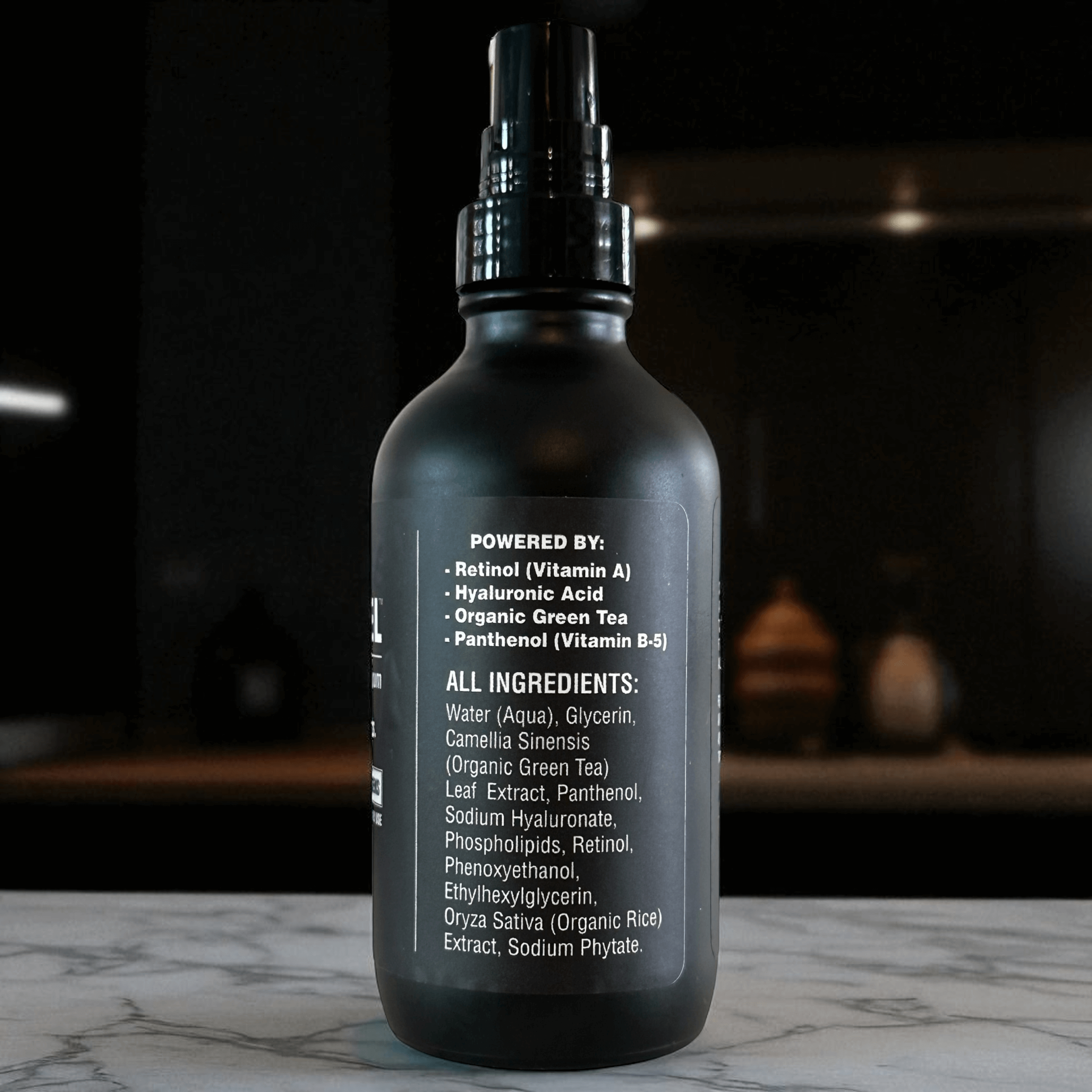 Blacksteel anti-aging serum for men bottle showing the ingredient label including retinol, hyaluronic acid, and organic green tea.